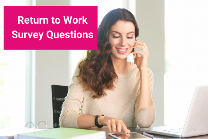 A woman is holding up the phone to her ear while she is working at a desk